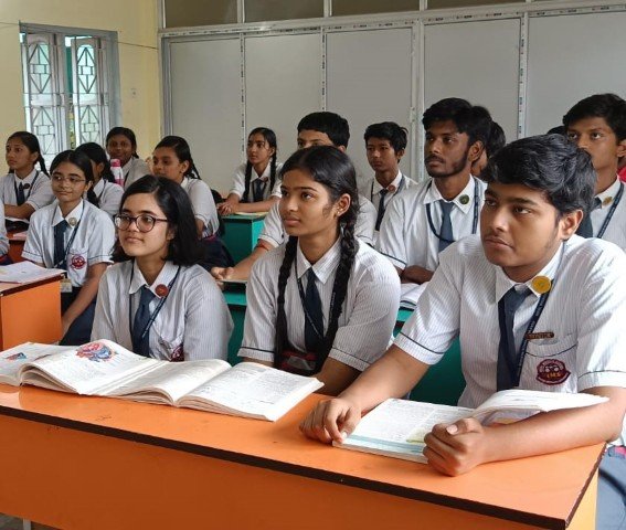 Students attending a classroom lesson at Ideal Mission School