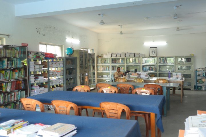 Bookshelves and reading tables in the Ideal Mission School library